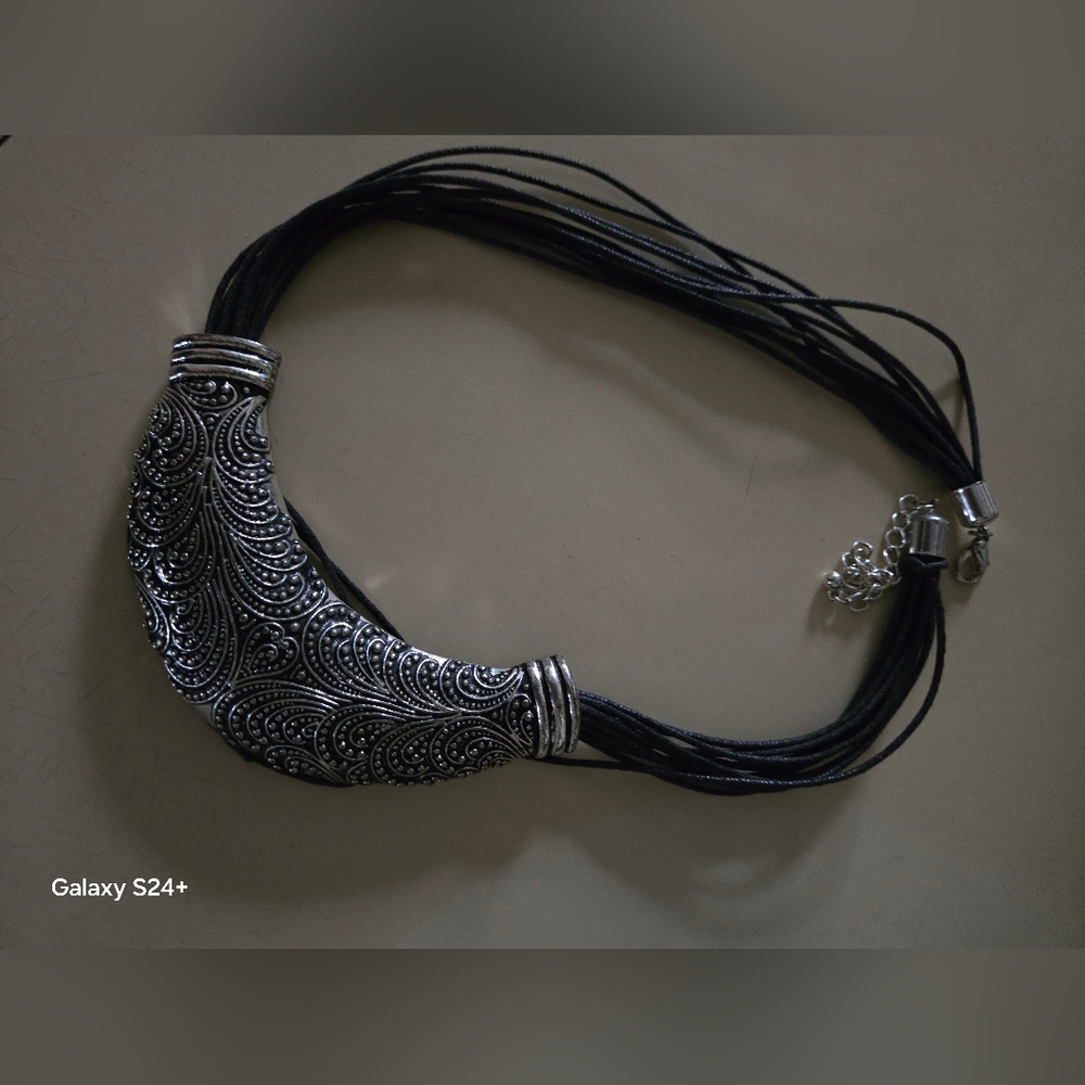 Intricate Silver Necklace with Black Cord